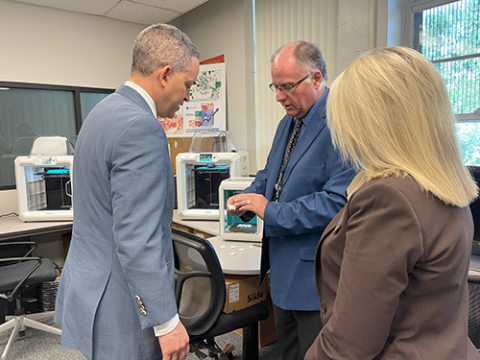 Department of Commerce Deputy Secretary Don Graves, Phoenix Community College President Dr. Kimberly Britt, and Paul Ross, PI for NTIA CMC Broadband and NSF Externships/Internships, tour the College's 3D Printing Lab during an NTIA site visit.